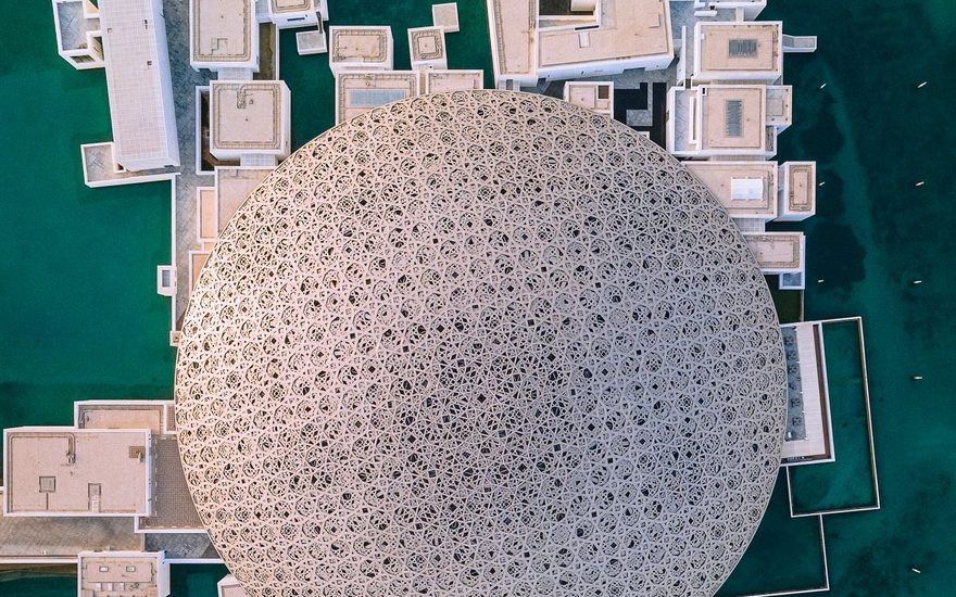 Louvre Abu Dhabi dome and the white galleries beneath it