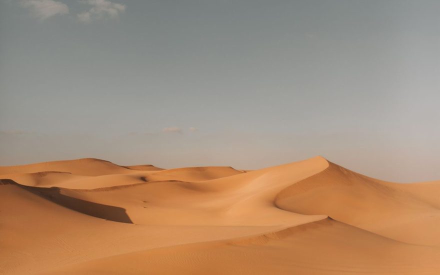 Desert dunes under a clear sky near Abu Dhabi